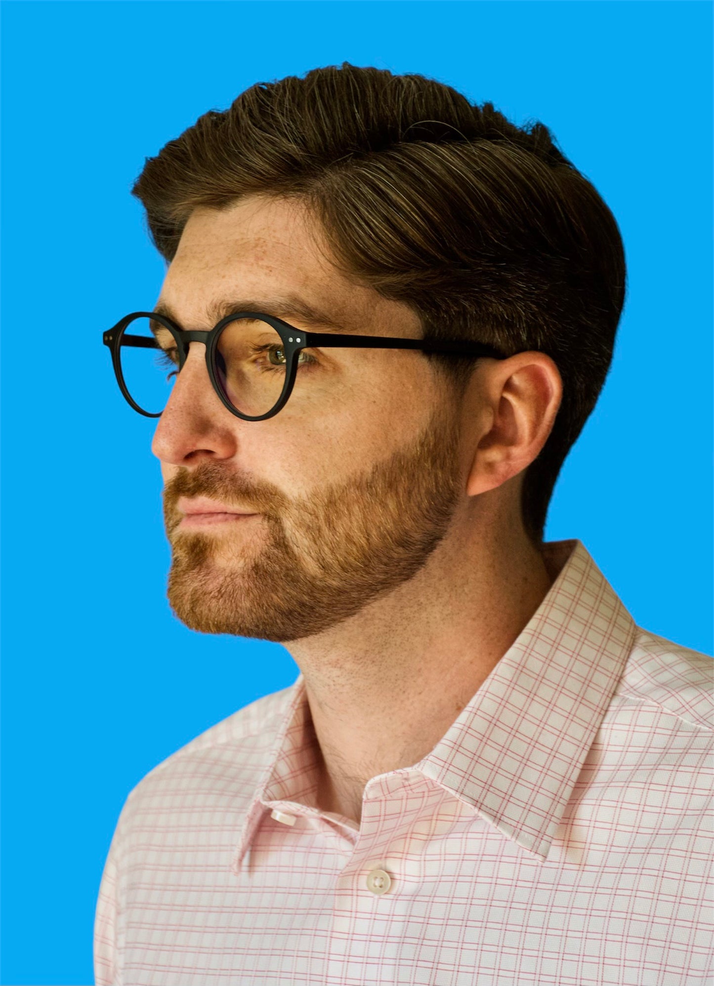 Side model view of Madeira fashionable round black glasses, fashionable, unisex, mens, womens, blue light blocking frames and glasses.