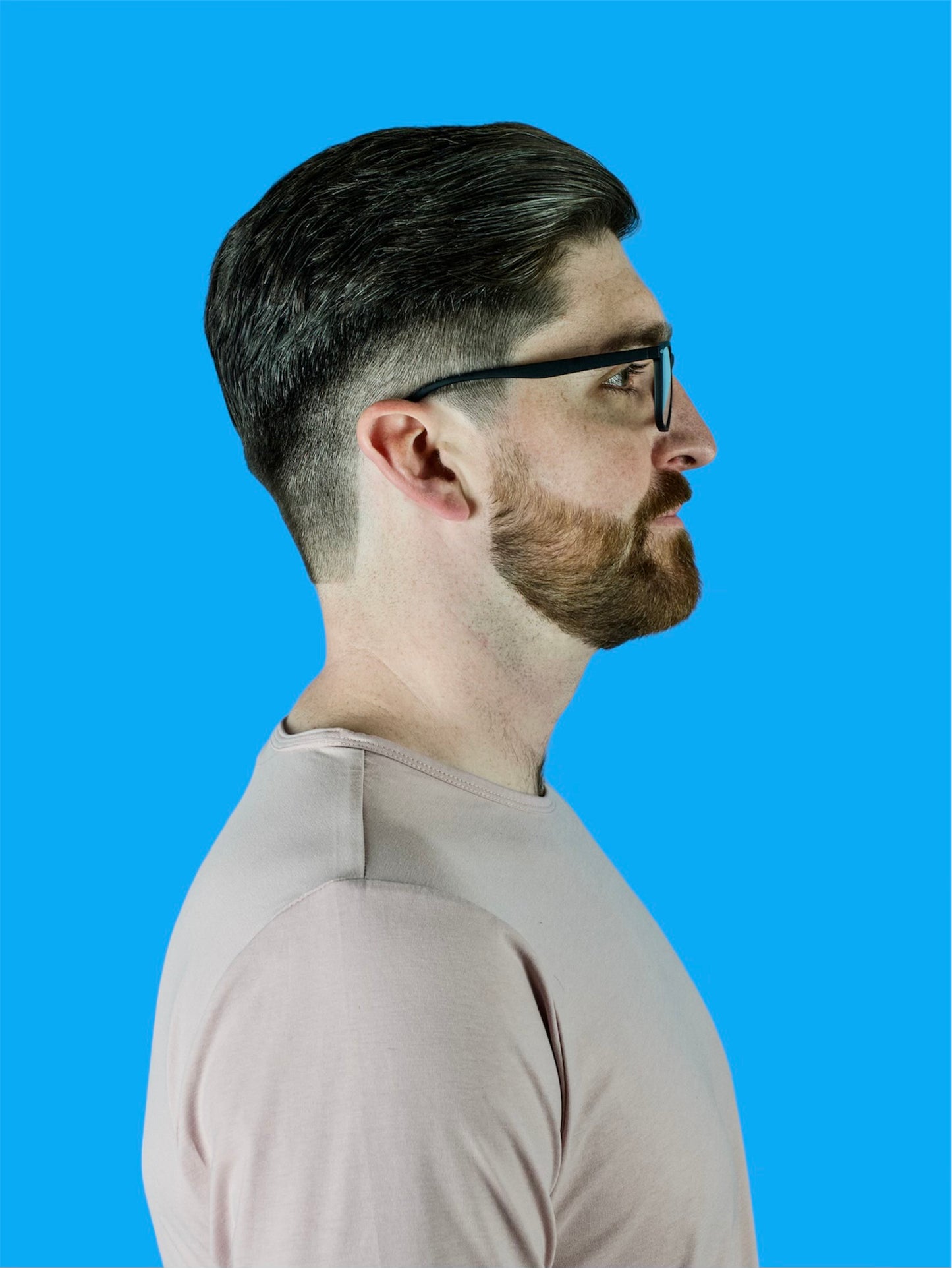 Side model view of Manhattan black, square, professional, men's blue light blocking frames and glasses.